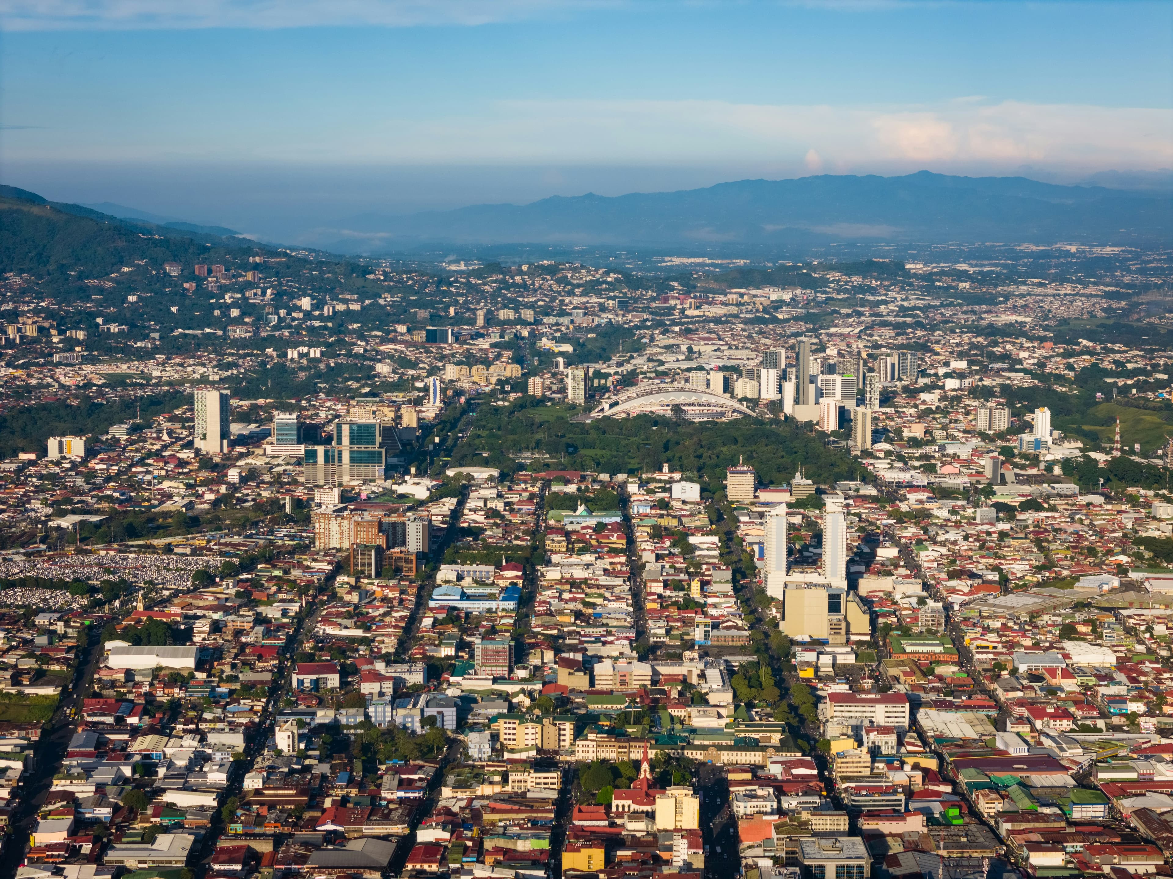 A city in Costa Rica with mountains in the background